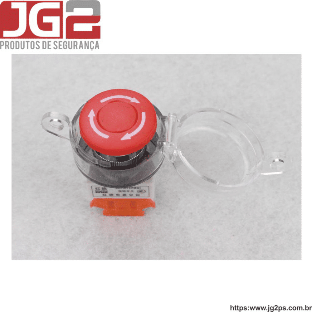 Imagem mostra o bloqueio para botão de emergencia feito de policarbonato de 30mm da empresa JG2, dentro dele vemos um botão vermelho.