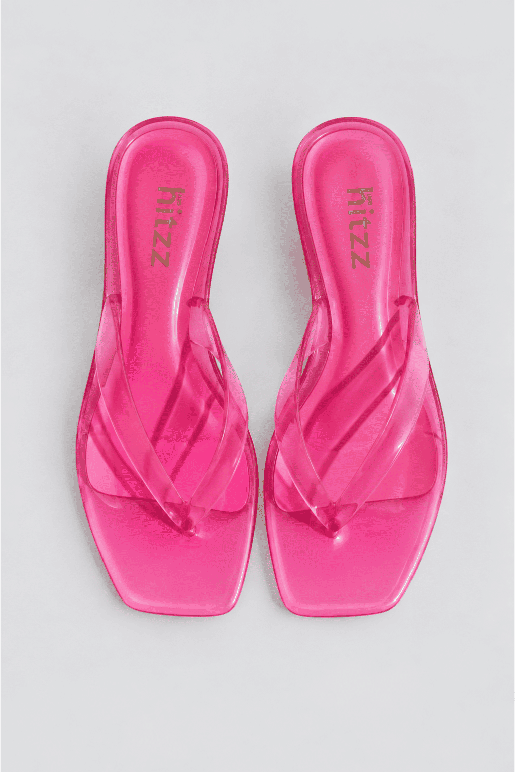 gummy-tamanco-feminino-translucido-rosa Tamanco Feminino Flip Flop Rosa - Gummy visto de lado, tira em vinil transparente rosa e salto fino translúcido baixo