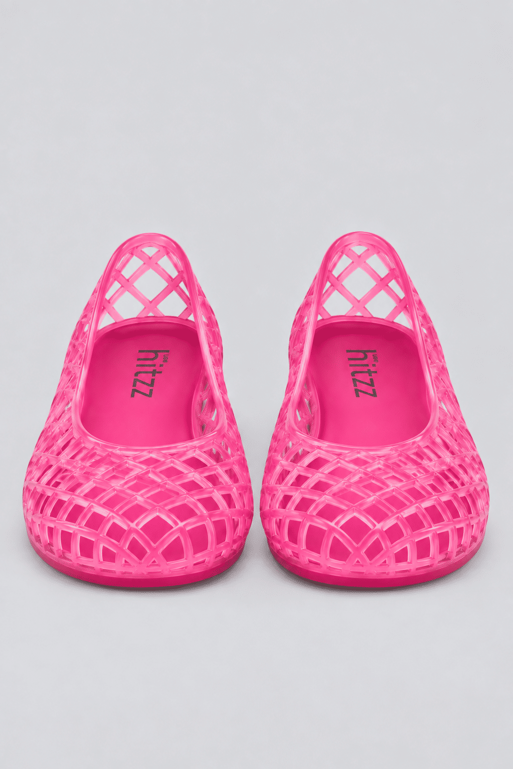 sapatilha-feminina-rosa-gummy Par da Sapatilha Feminina Rosa - Gummy fotografado de frente, com a marca "hitzz" visível nos dois solados internos.