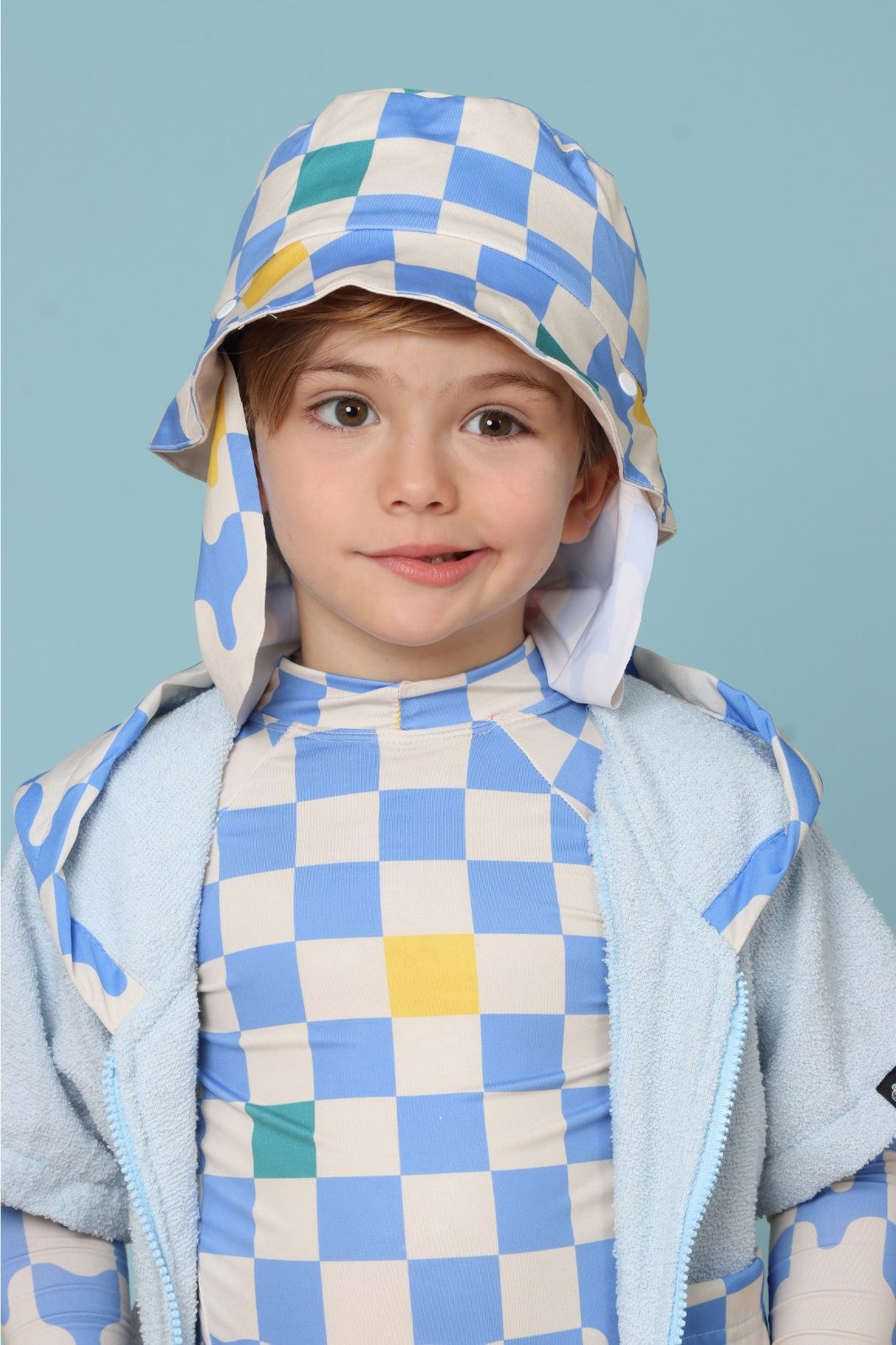Chapéu infantil Proteção Solar UV 50+ Dupla Face Ajustável Off White e Azul Quadriculados Chapéu infantil Proteção Solar UV 50+ Dupla Face Ajustável Off White e Azul Quadriculados