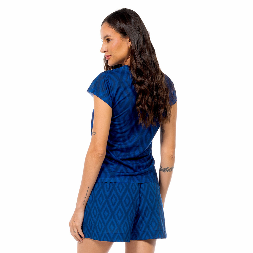 Baby Look Florata Maxi Arara Fundo Azul Baby Look Florata Maxi Arara Fundo Azul