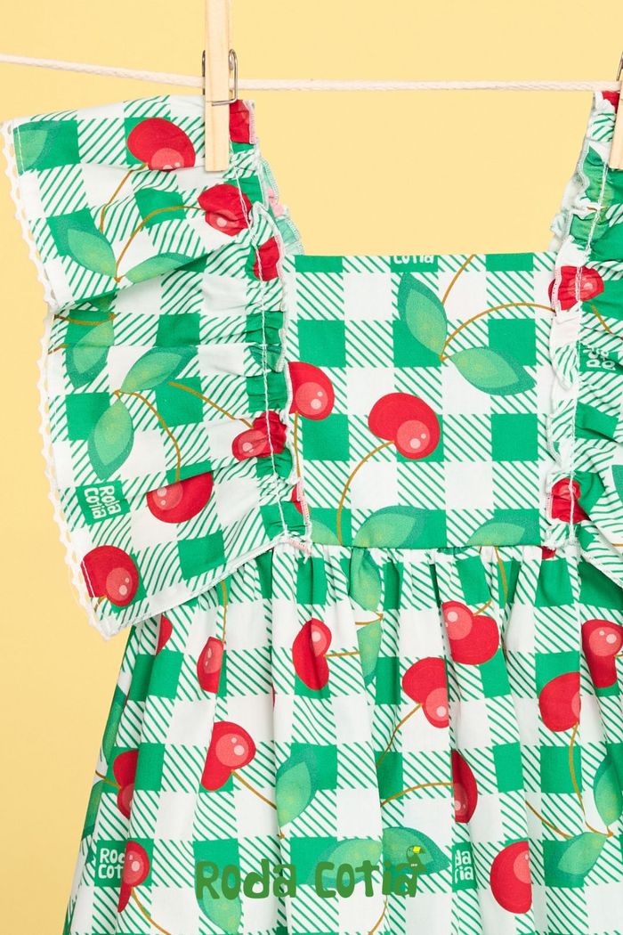 Vestido baby com estampa xadrez e cerejas