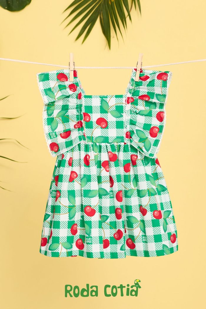 Vestido baby com estampa xadrez e cerejas