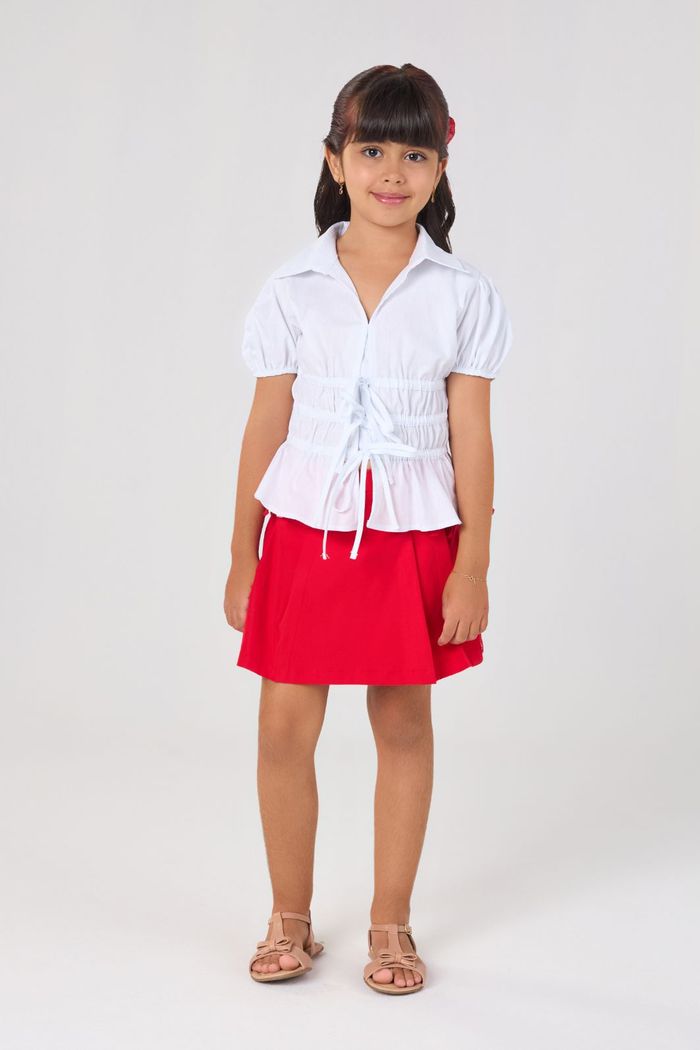 Saia de alfaiataria com pregas