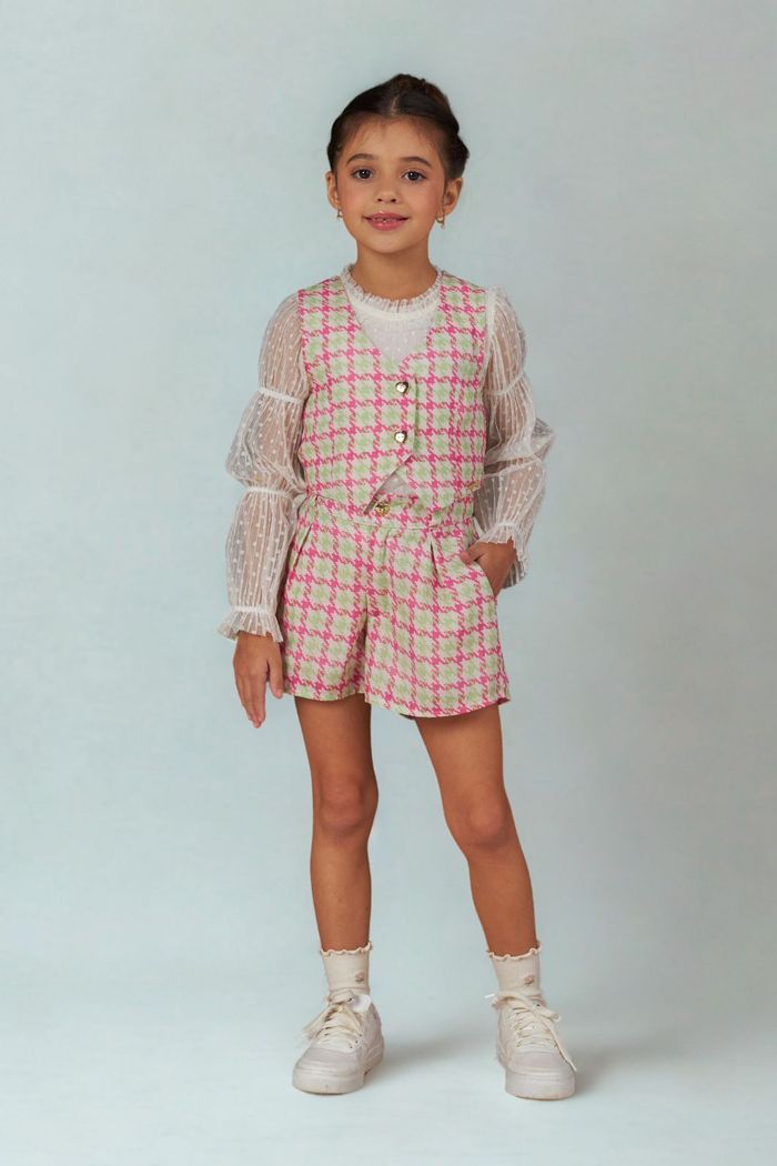 Blusa de tule poá com detalhes na manga bufante