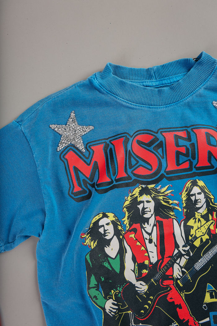 T-SHIRT INFANTIL AZUL MISERY COM APLIQUE ESTRELAS