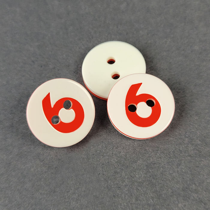 100.795 - BOTÃO COM 12 UN.