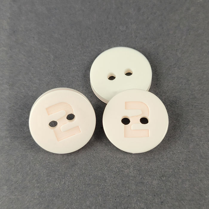 100.771 - BOTÃO COM 12 UN.