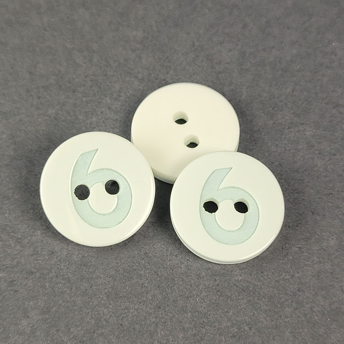 100.785 - BOTÃO COM 12 UN.