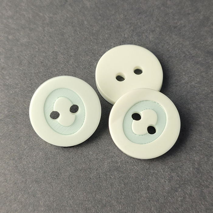 100.779 - BOTÃO COM 12 UN.