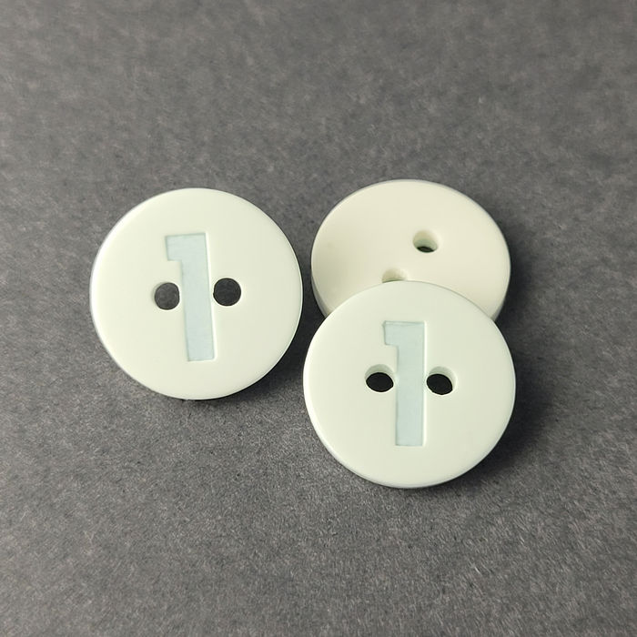 100.780 - BOTÃO COM 12 UN.