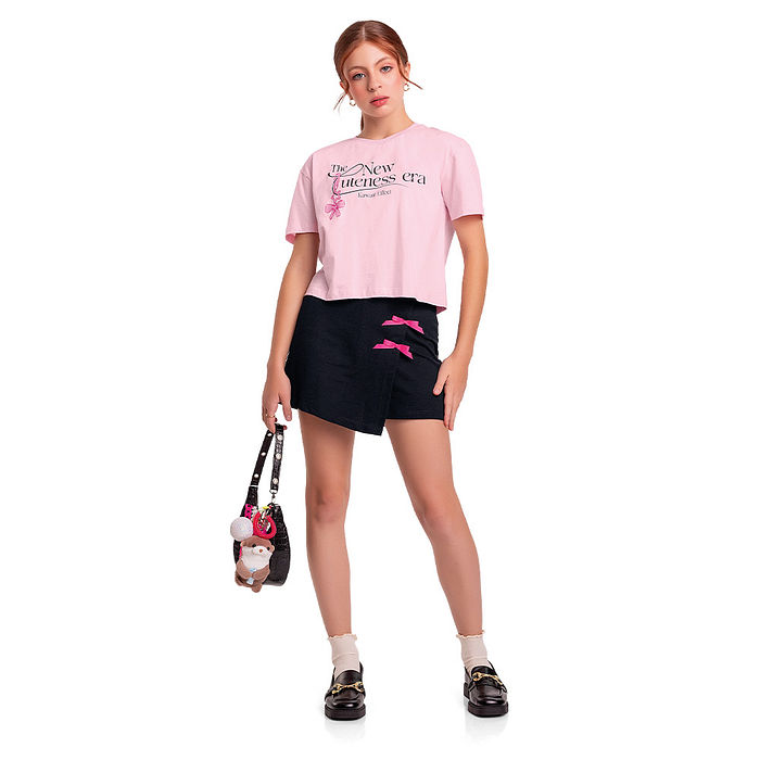 Short saia juvenil em moletinho com laços decorativos