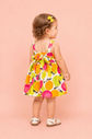 Vestido estampa de frutinhas com detalhe de amarração nas costas