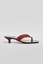 gummy-tamanco-feminino-transparente-salto-baixo-marrom Tamanco Feminino Flip Flop Gummy marrom em PVC translúcido, salto baixo fino e bico quadrado, vista lateral