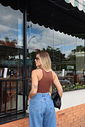 body feminino em poliamida com modelagem ajustada, frente e costas duplas, zero transparência, design nadador e fechamento por botões de pressão, peça confortável e versátil