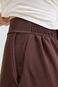 calça pantalona feminina em alfaiataria com cintura alta e elástico nas costas, caimento fluido que não marca o corpo, modelagem ampla com pernas soltas e bolsos laterais funcionais