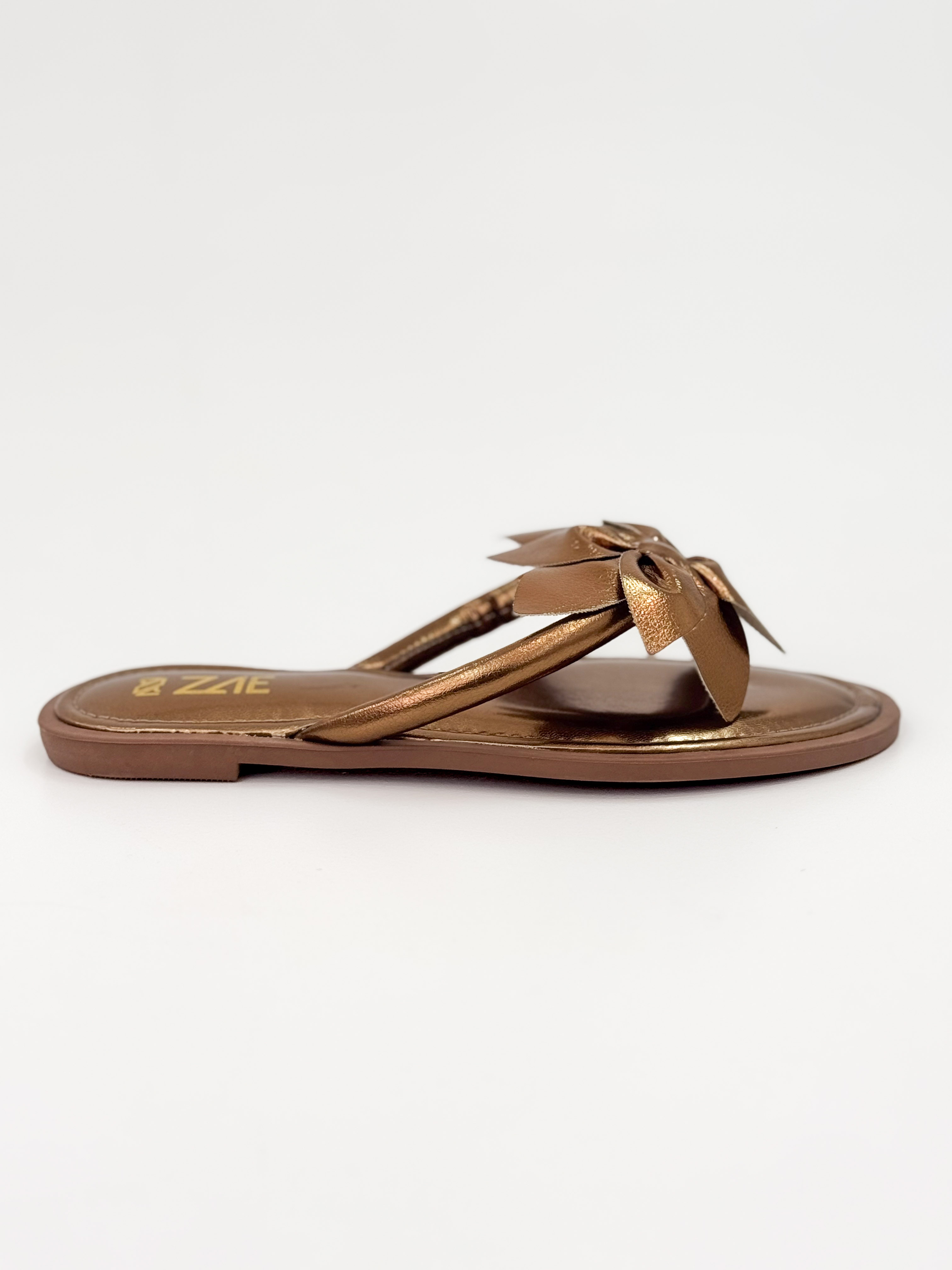 Dani — Chinelo Rasteira Bronze com Laço