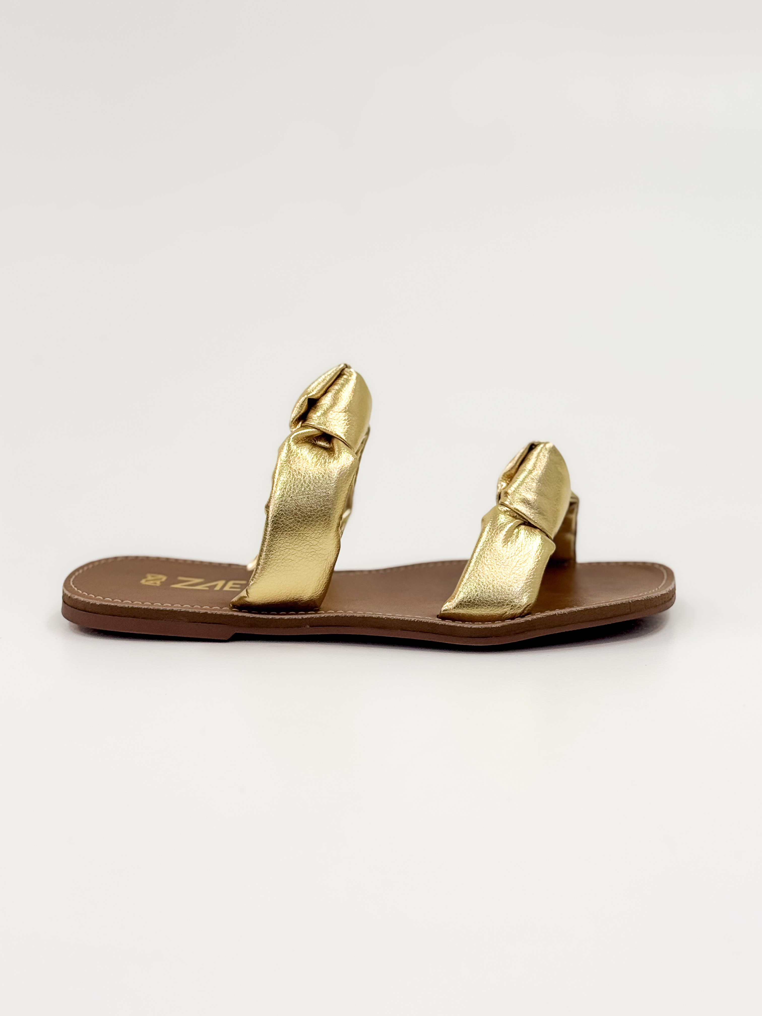 Luana — Chinelo Rasteira Ouro com Tiras Torcidas
