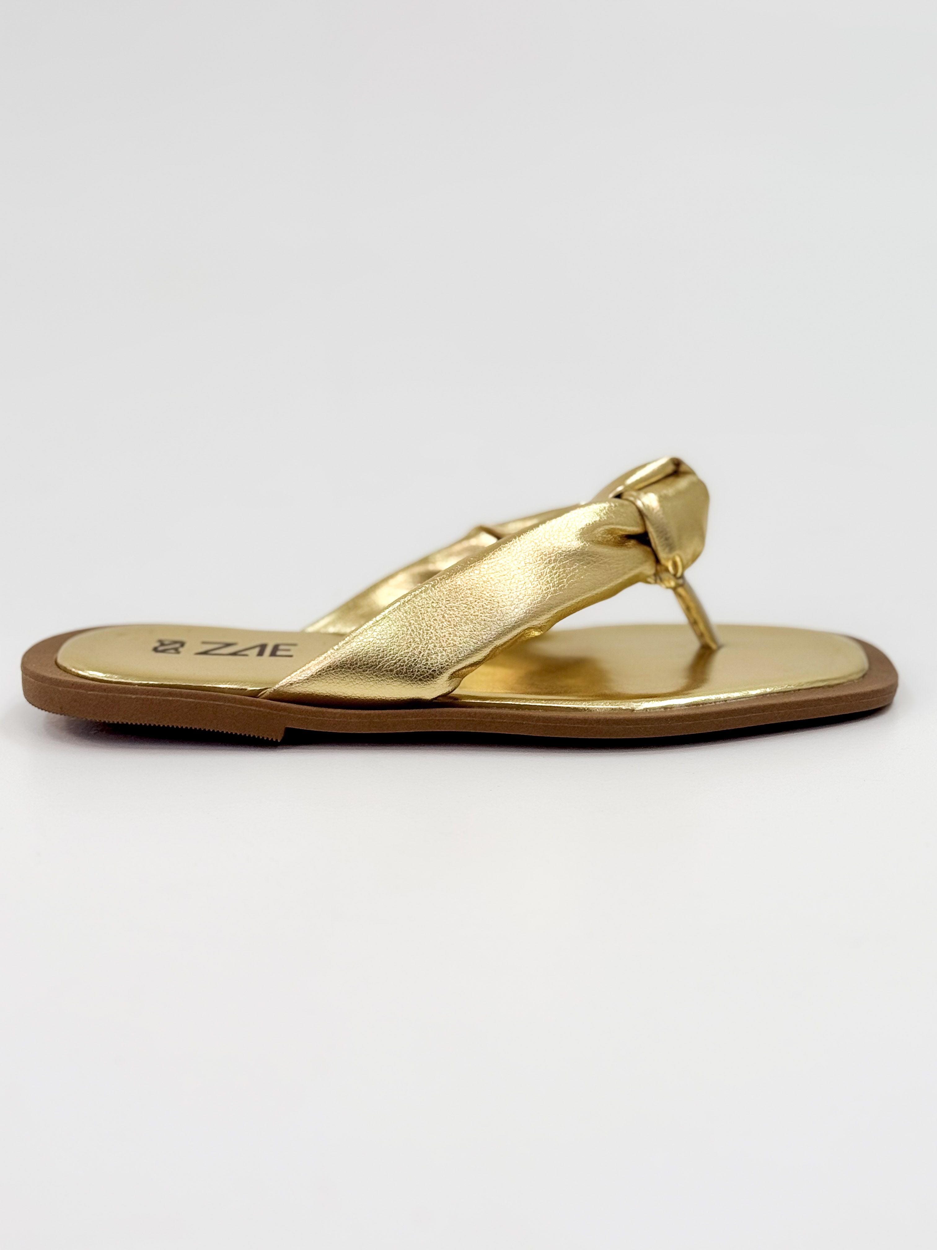Lourdes — Chinelo  Rasteira Ouro com Tira Torcida