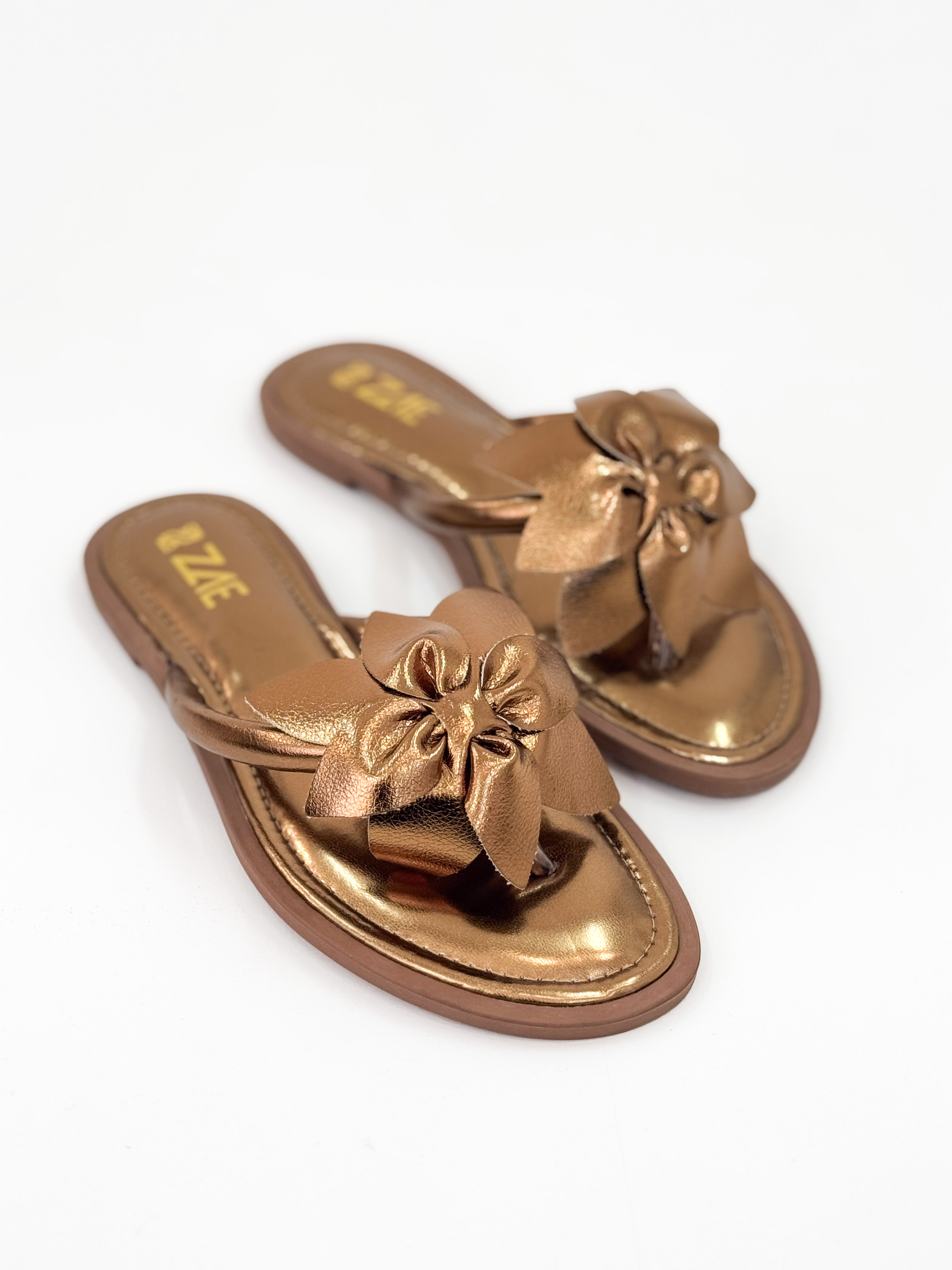 Dani — Chinelo Rasteira Bronze com Laço