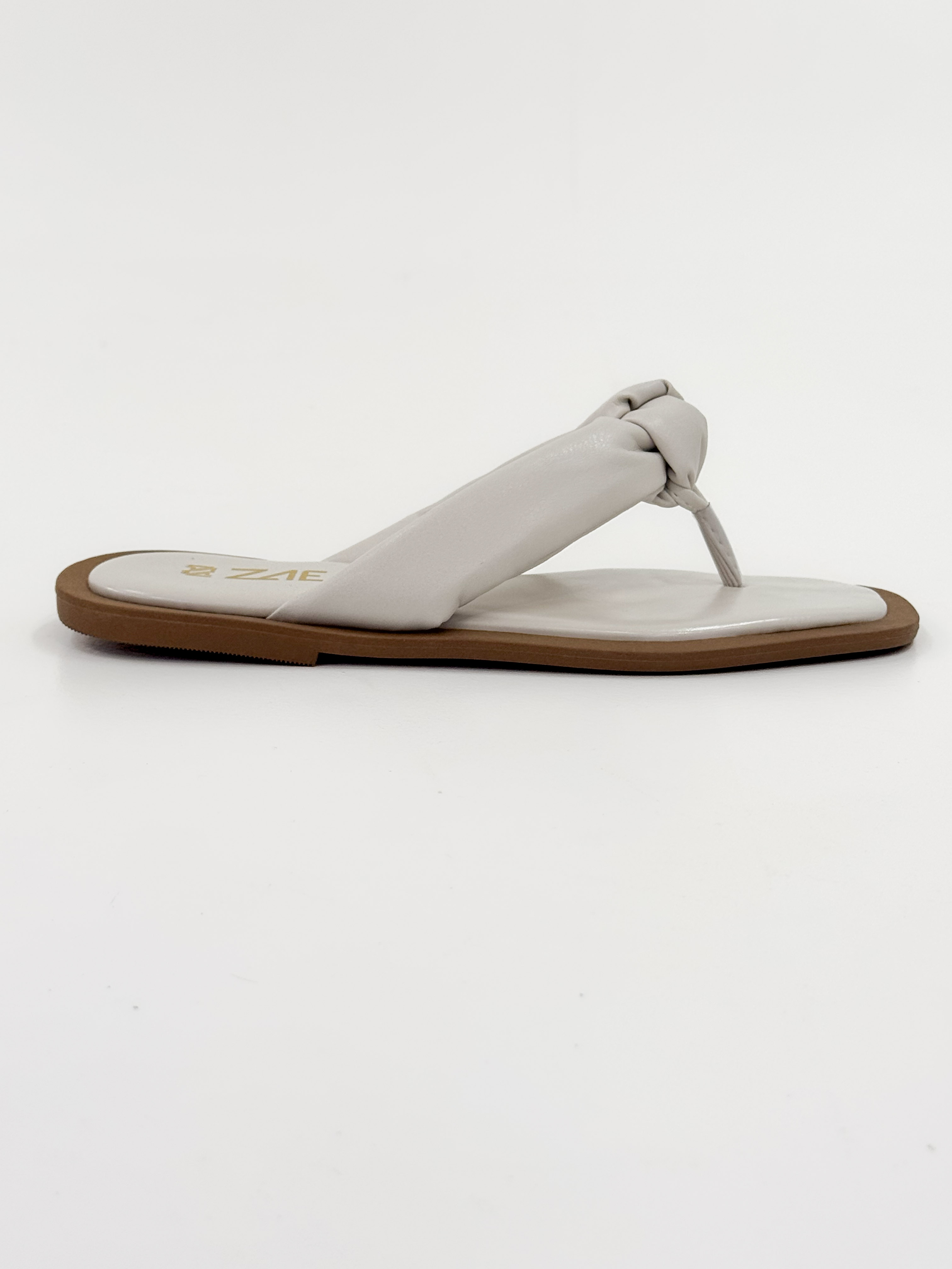 Lourdes — Chinelo Rasteira Off White com Tira Trançada Lourdes — Chinelo Rasteira Off White com Tira Trançada