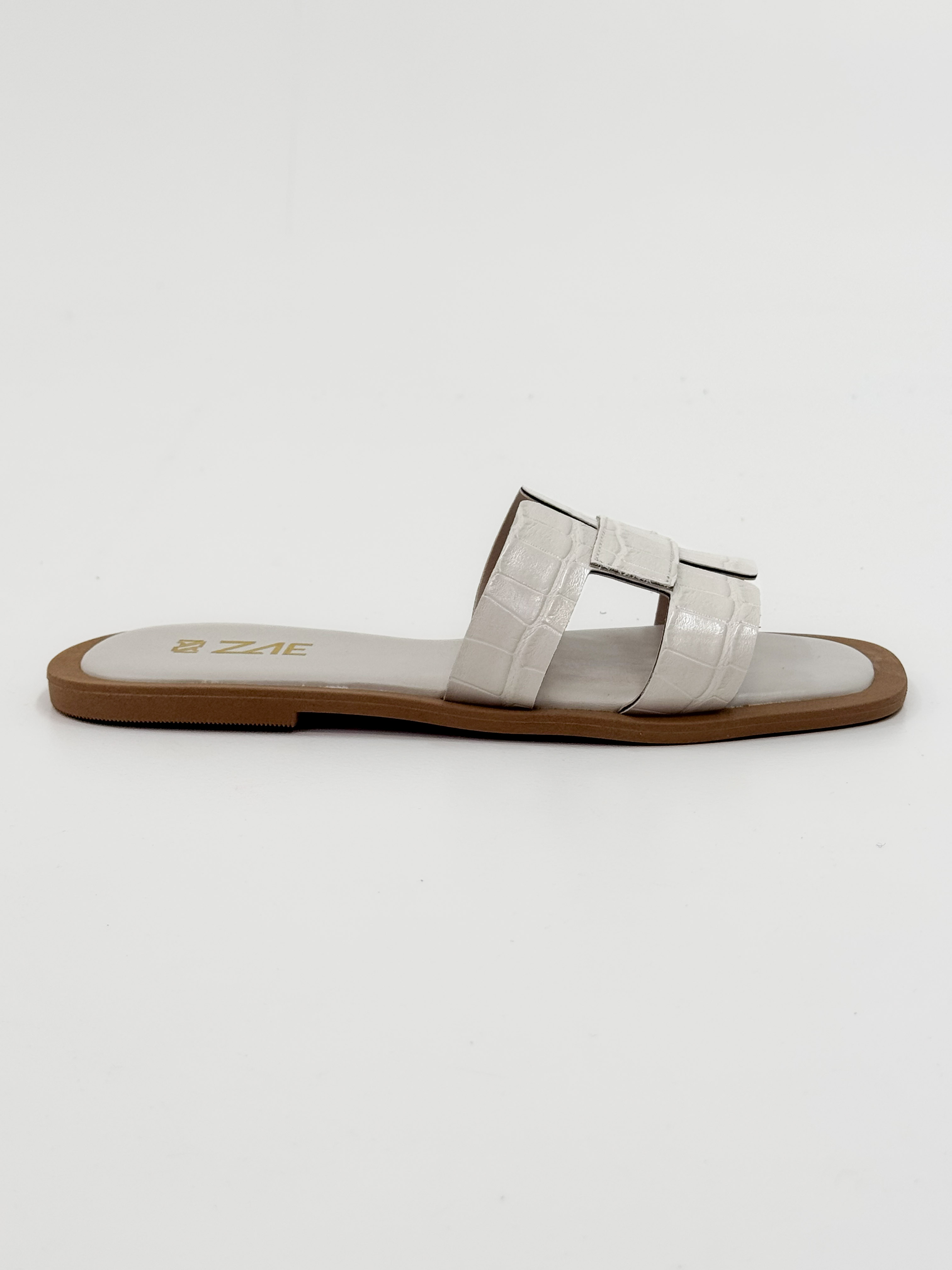Camila — Chinelo Rasteira Panacota com Tiras Texturizadas Camila — Chinelo Rasteira Panacota com Tiras Texturizadas